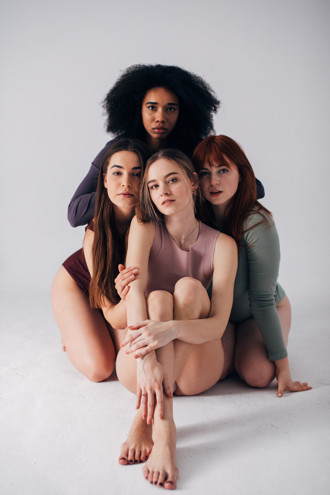 Women Posing Close Together